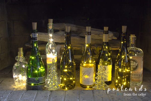 empty wine bottles with fairy lights