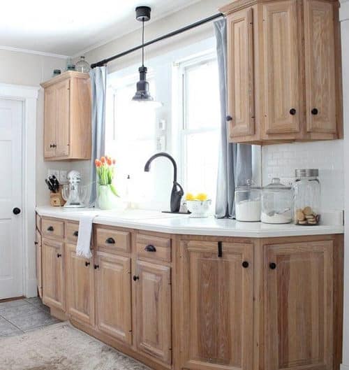 kitchen with wood cabinets with liming wax