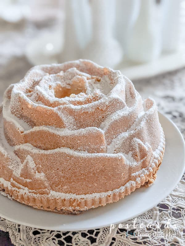 rose shaped cake made with Bundt pan and sprinkled with powdered sugar