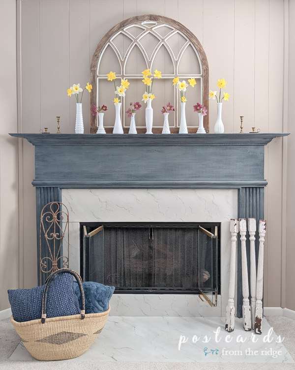 spring mantel with white milk glass vases and flowers
