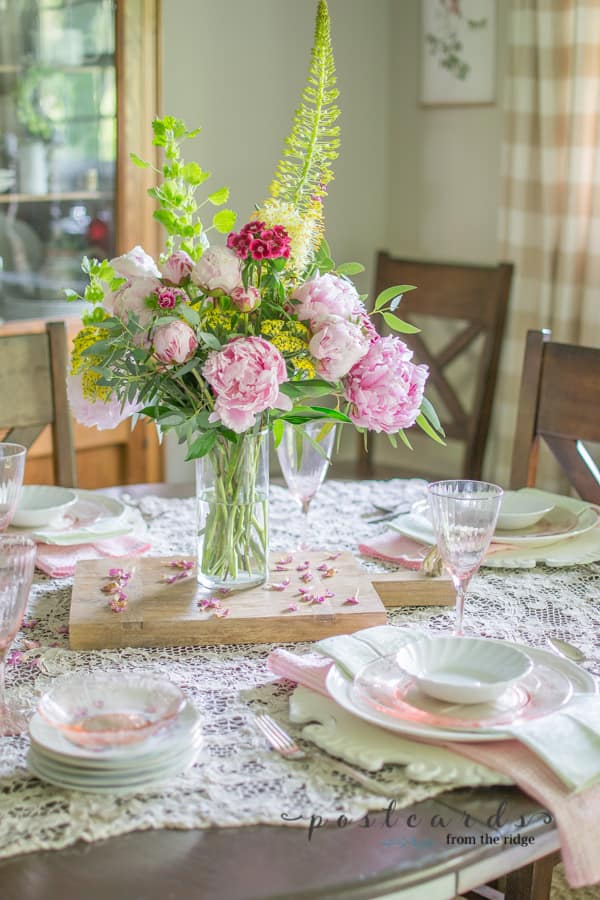 spring table with pink peony centerpiece