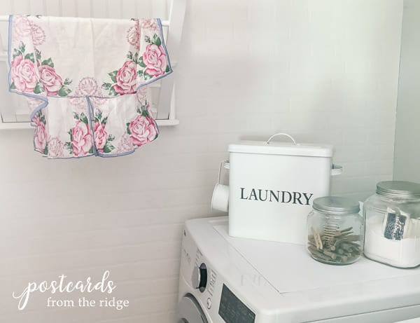 laundry room with floral apron and Duck Brand Smooth Top Easy Liner used on top of dryer