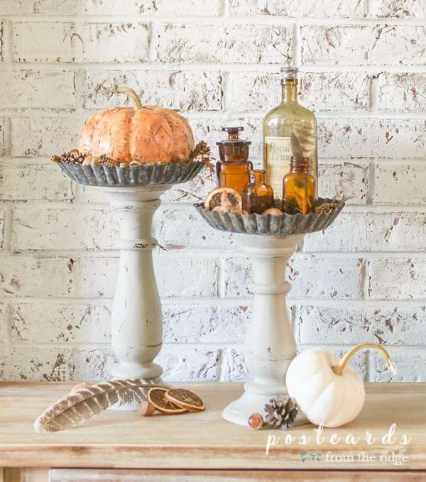 salvaged pans and candlesticks repurposed into pedestals