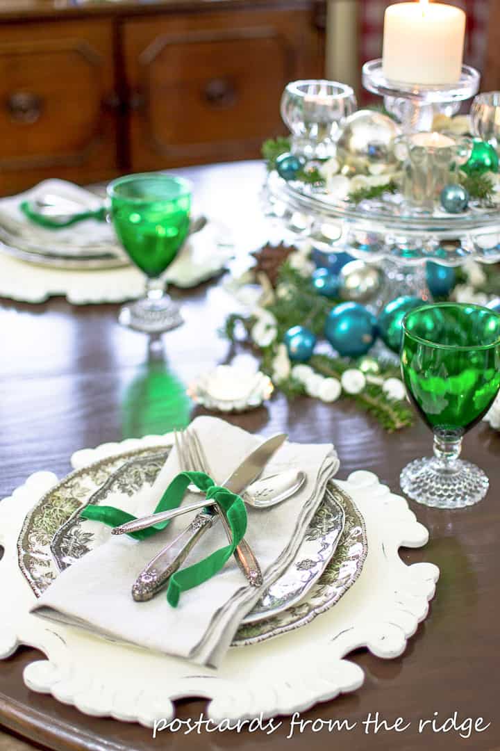green glasses and blue decorations on a Christmas table