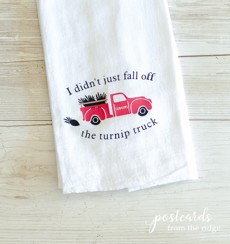 red truck on tea towel personalized with cricut iron-on material