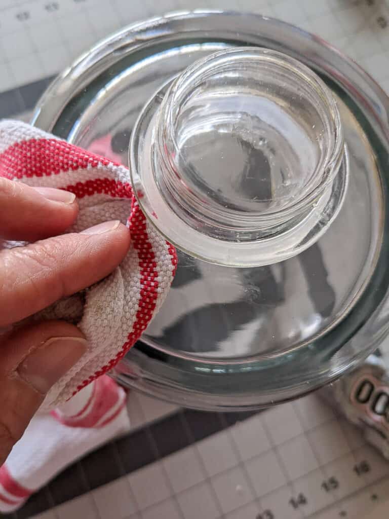 wiping excess glue from glass cloche