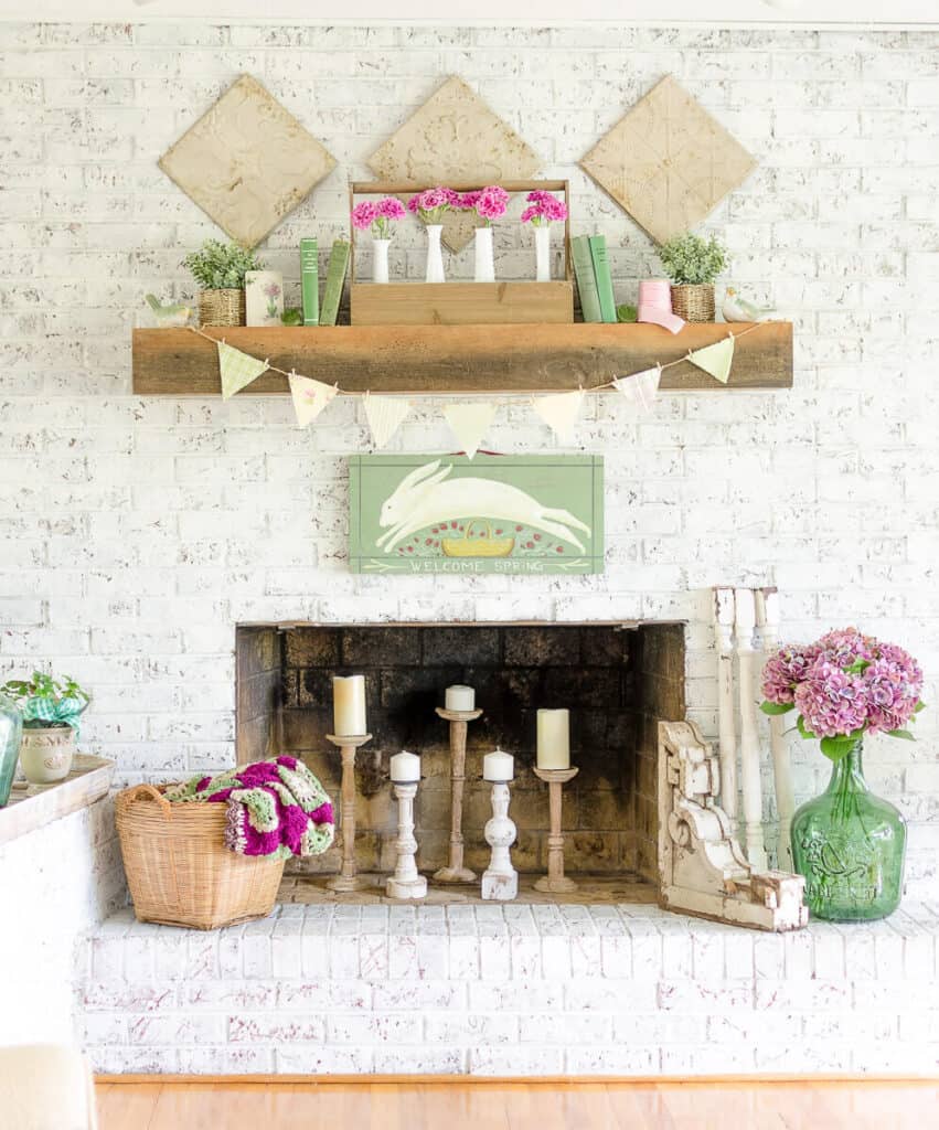 spring mantel decorated with green and pink decor