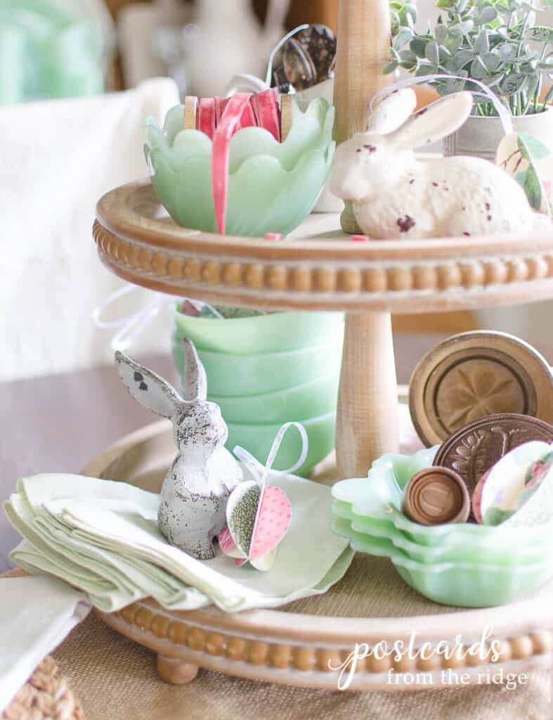 cast iron bunnies and vintage jadeite on wooden tiered tray