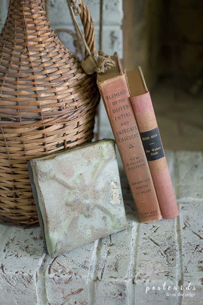 white painted brick fireplace heart with vintage decor