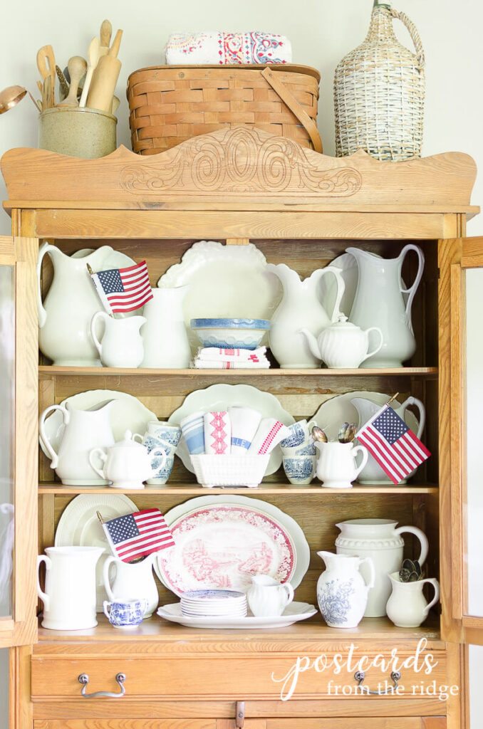 antique hutch with vintage white ironstone and blue willow dishesand