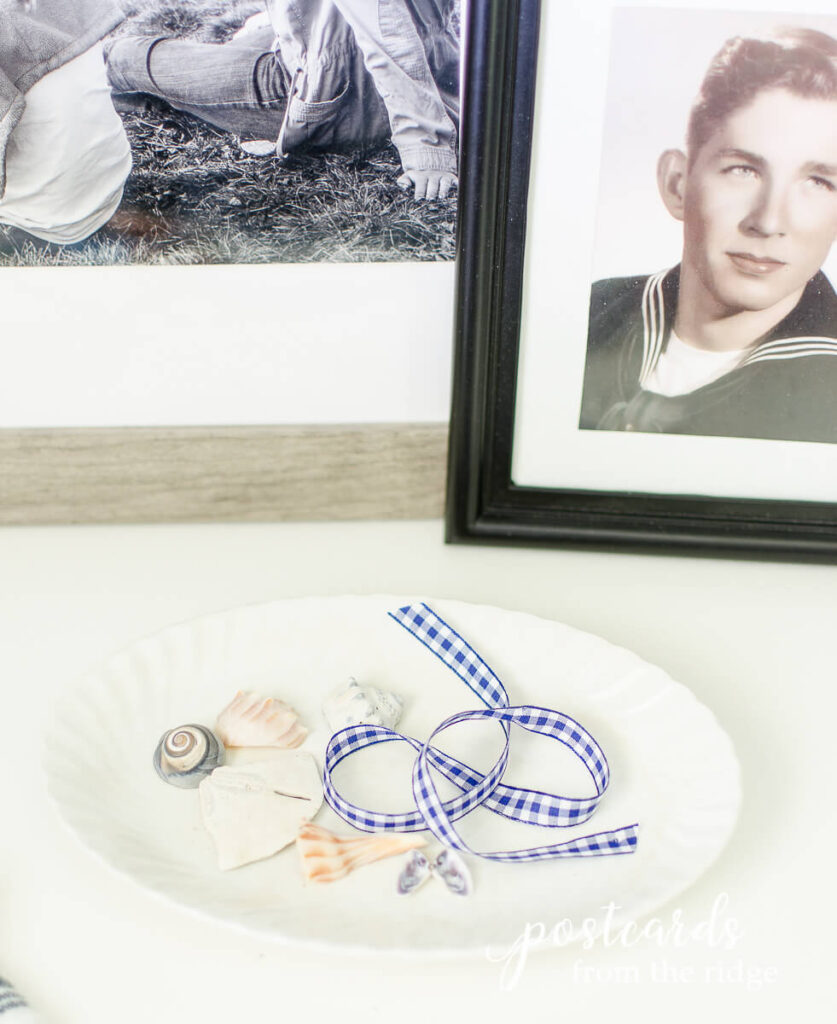 white ironstone dish with blue gingham ribbon and seashells