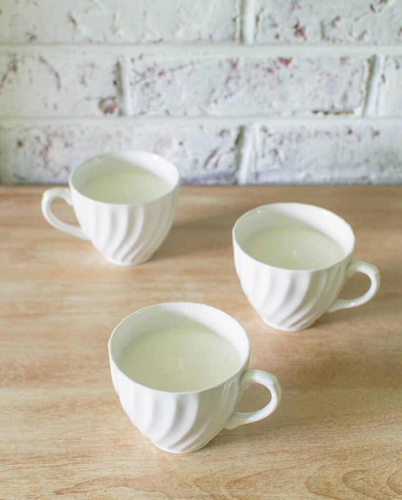 homemade soy candles in vintage white ironstone teacups