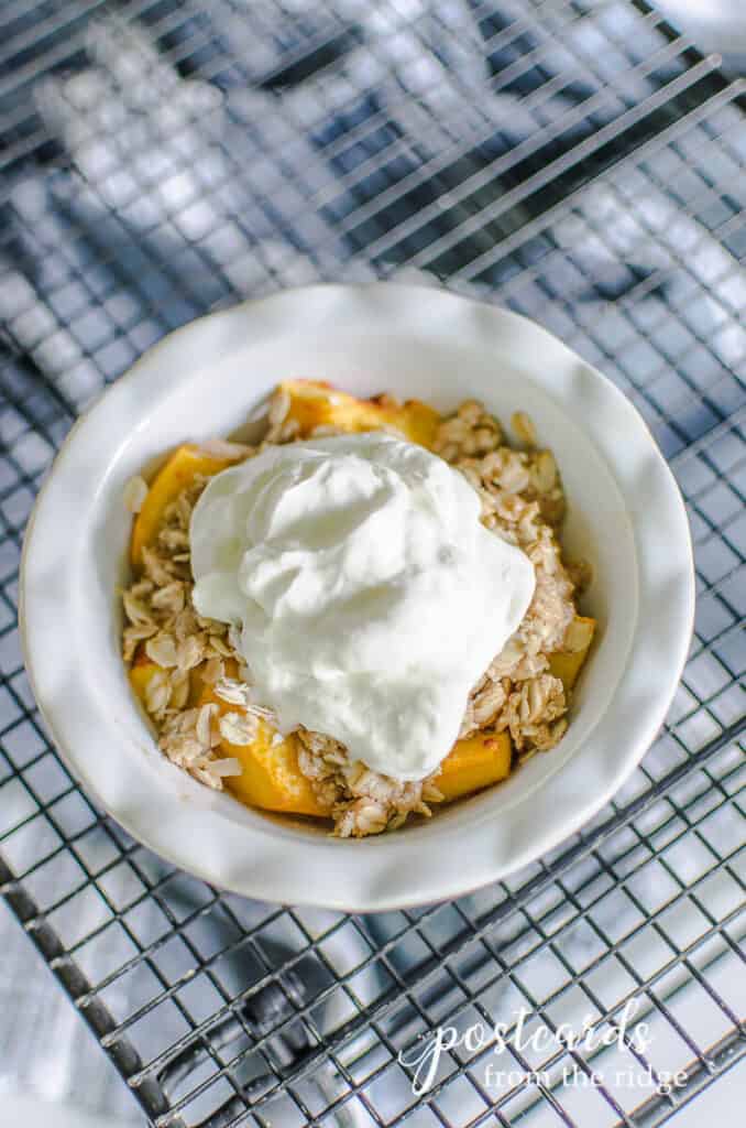 mini peach crisp with whipped cream