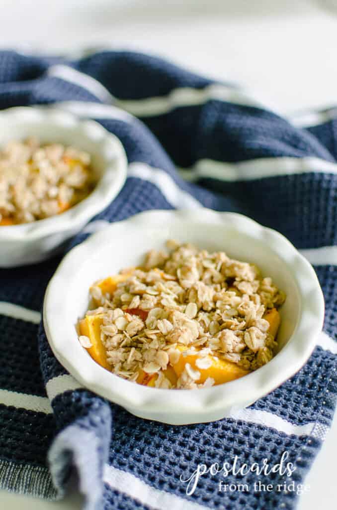 mini peach crisps on a blue kitchen towel