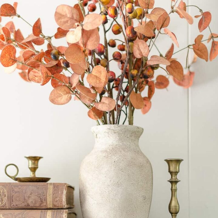 glass vase painted to look like stoneware with faux rust branches