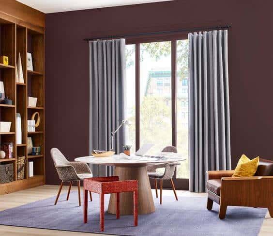 dining room with walls painted in Sherwin Williams carnelian