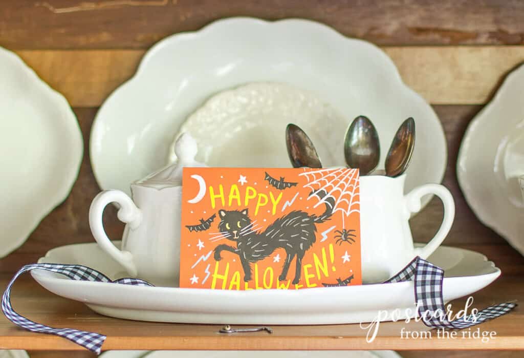 happy Halloween greeting card with black cat