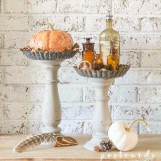 faux pumpkins on pedestal