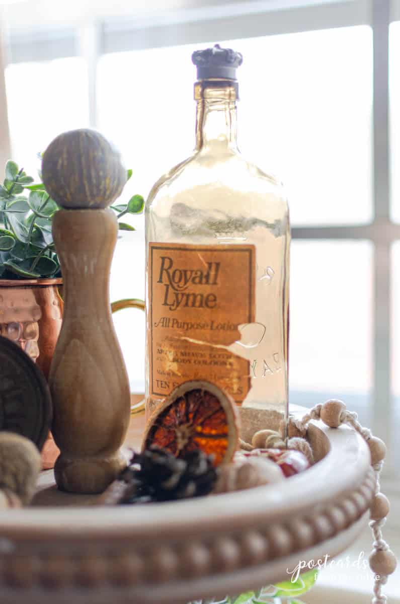 vintage amber bottle on wooden three tier tray
