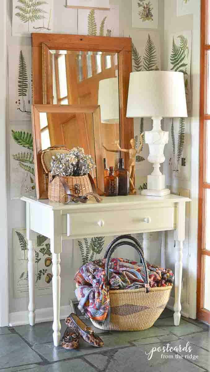 small white desk with baskets and fall decor items