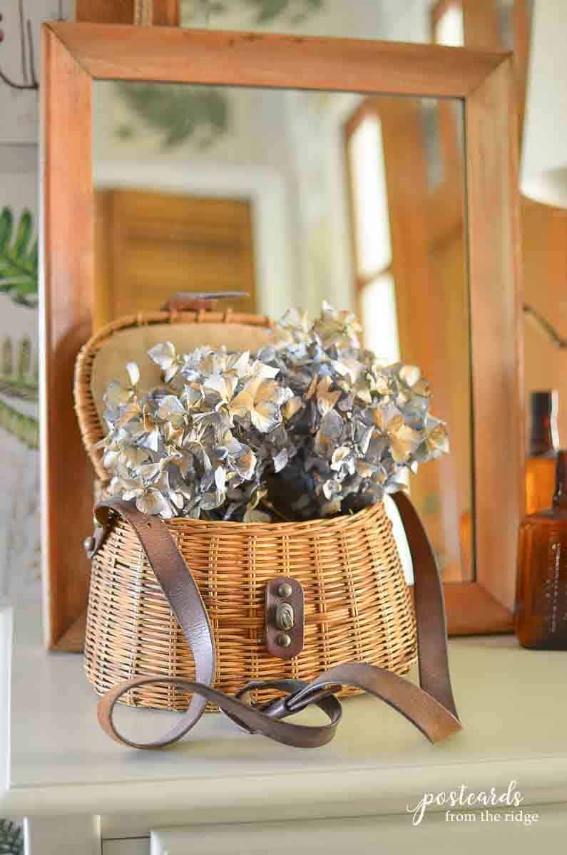 vintage fishing creel with dried hydrangeas