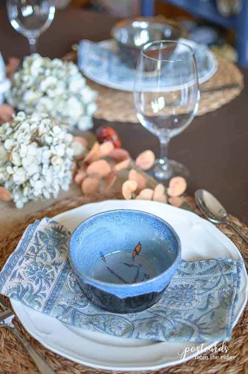 block print napkins and pottery bowl place setting