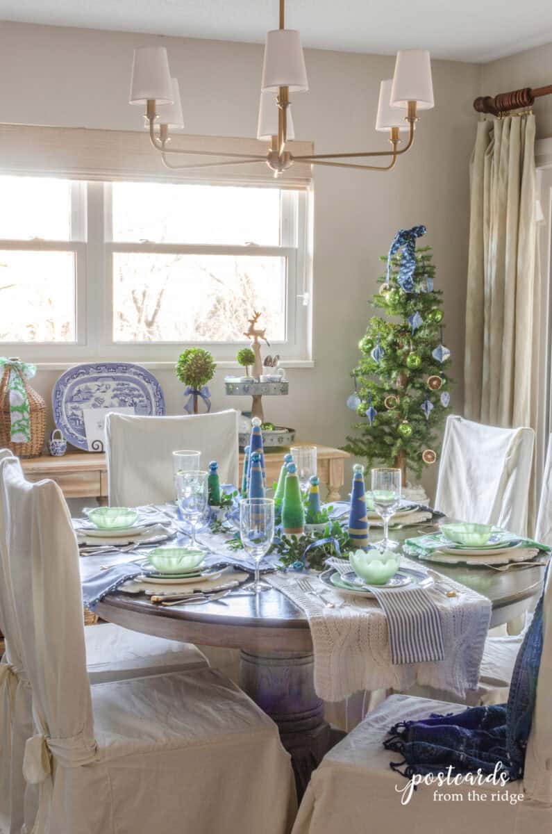 dining room with blue and green Christmas decorations