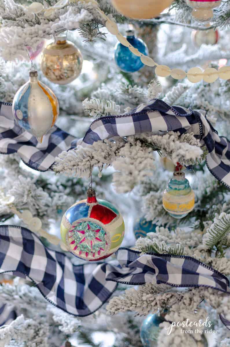 vintage Polish and Shiny Brite Christmas ornaments on a King of Christmas flocked tree