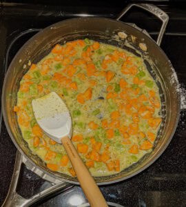 chicken pot pie ingredients being sauteed