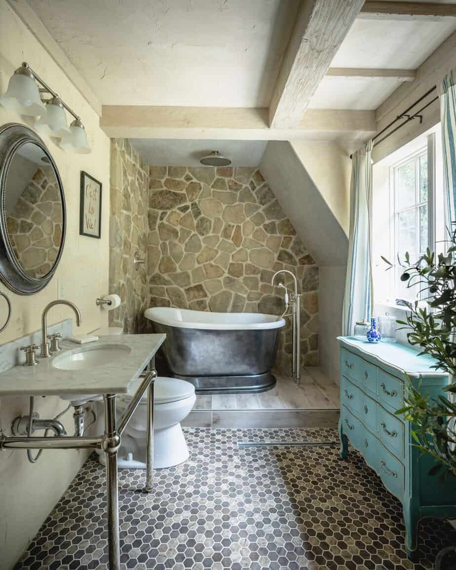 Cottage from The Holiday movie bathroom with freestanding tub and tile floors