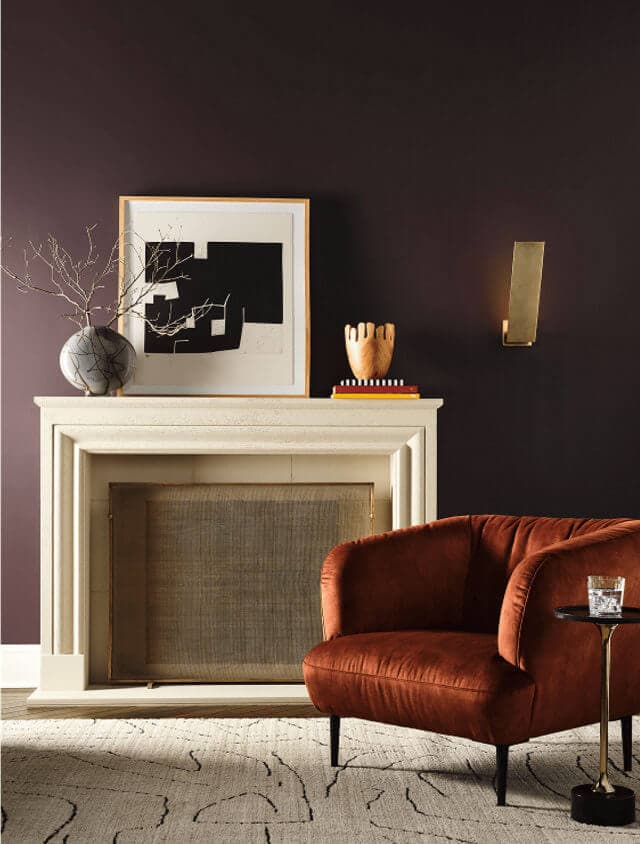 Sherwin Williams 2027 color palette bitter chocolate living room with rust velvet chair and off white fireplace