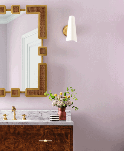 Sherwin Williams Mauve Finery bathroom with wood vanity and woven mirror