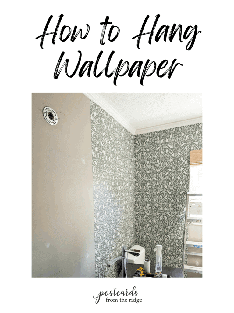 wallpaper being hung in a bathroom