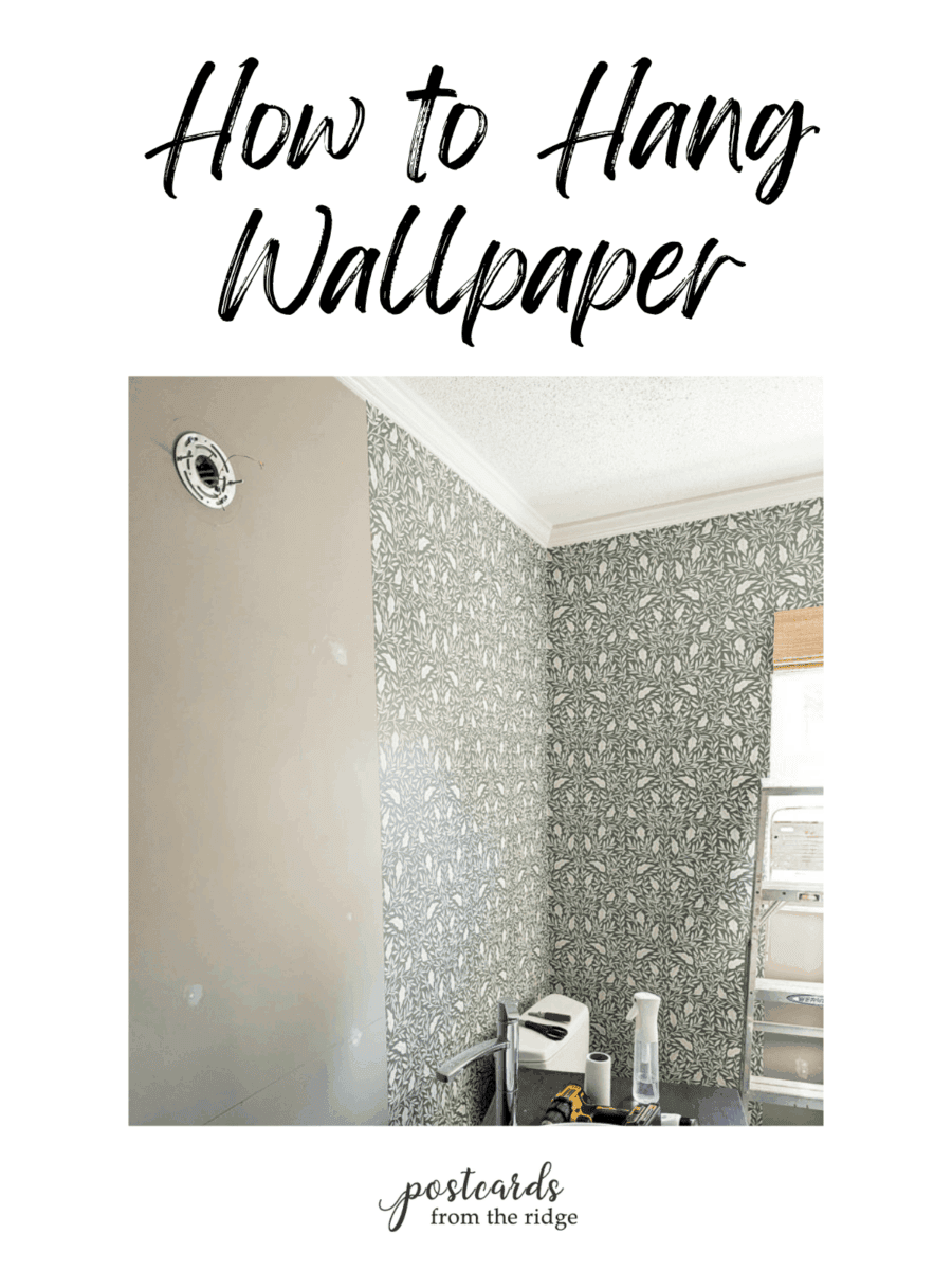 wallpaper being hung in a bathroom